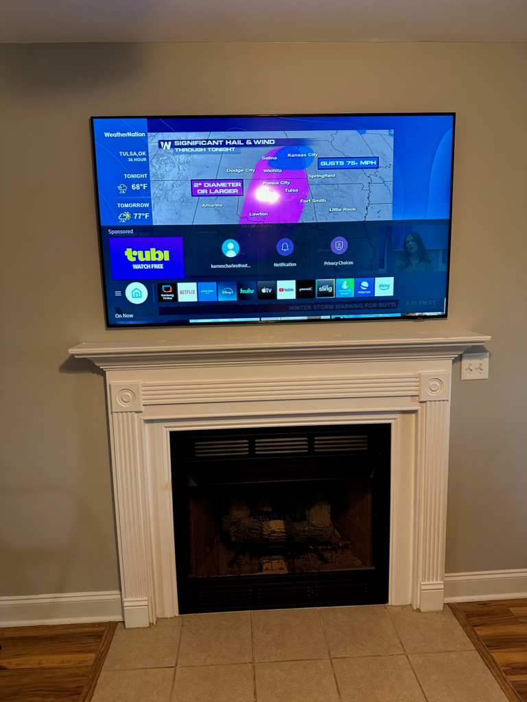 65" TV Mounted Above Fireplace